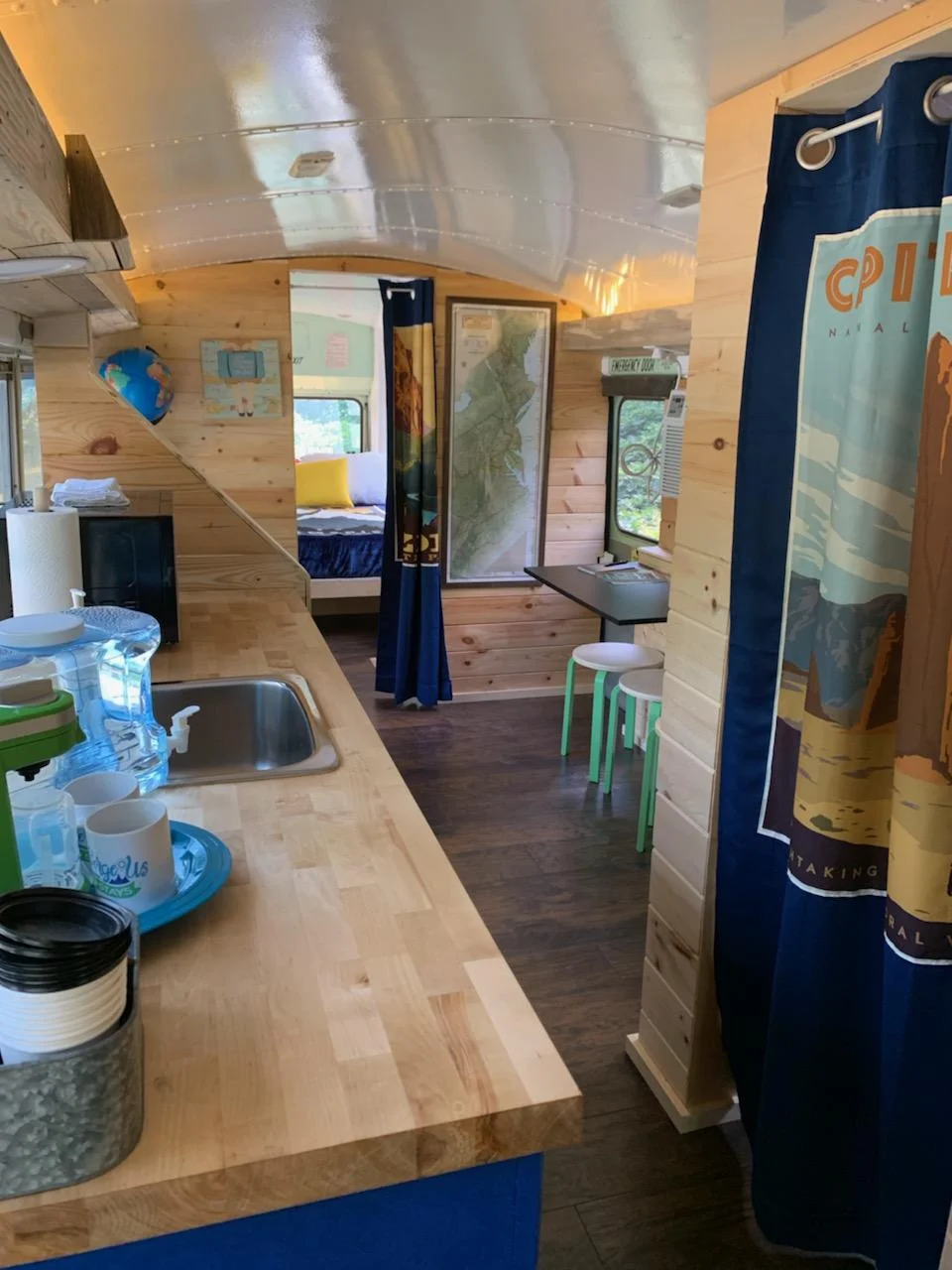 The Travel-Inn Skoolie bus with a rustic modern interior